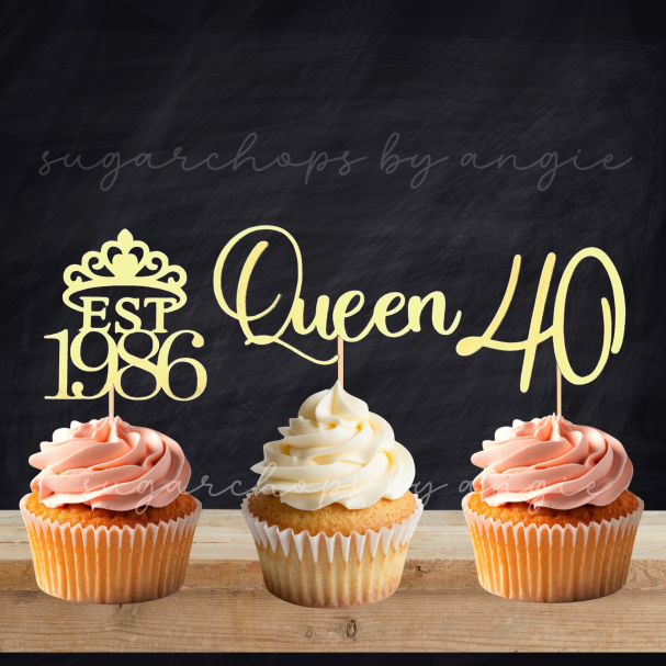Three cupcakes with decorative toppers: "EST 1986", "Queen", and "40".