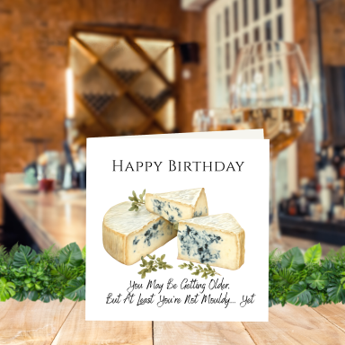 Cheese Lovers Birthday Card A birthday card with a cheese illustration and a humorous message about aging.